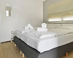 Tweede slaapkamer met comfortabele bedden in Vitamaris appartement, Schiermonnikoog.