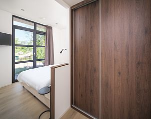 Slaapkamer in Vrijstaande woning in Workum, vakantiehuis met comfortabele bedden nabij IJsselmeer en Friese meren.