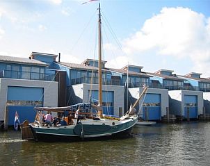 Traditional vacation home boat at Recreation Company 'on the water', Heeg, Frisian lakes.