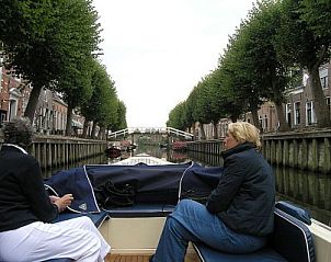 Boat trip through historic canals near Recreation Company 'on the water', Heeg, Frisian lakes.