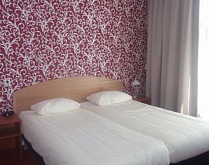 Gezellige zithoek in Die Port van Cleve vakantiehuis, Enkhuizen, met comfortabele stoelen aan de IJsselmeerkust.