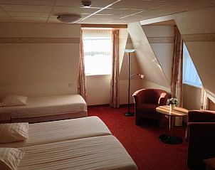 Comfortabele slaapkamer in SuyderSee Hotel, vakantieappartement in Enkhuizen, Noord-Holland.