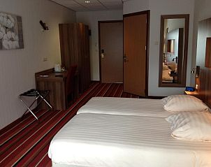 Comfortabele slaapkamer in SuyderSee Hotel, vakantieappartement in Enkhuizen, Noord-Holland.