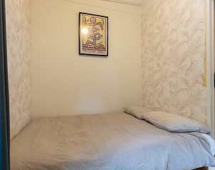 Overdekt terras bij vakantiehuis DG1812 in Spier, ideaal voor buiten dineren.