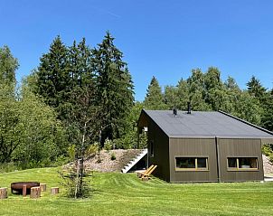 Vacation home in Spier, Central Drenthe, surrounded by green nature and an inviting terrace for relaxation.