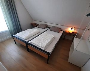 Tweede slaapkamer in Huisje in Schoonloo, ideaal voor gezinnen die Drenthe bezoeken.