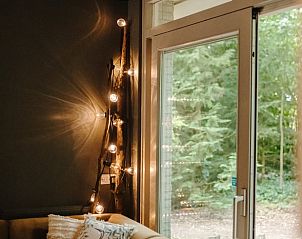 Illuminated indoor space in Cottage in Gasselte, vacation home with forest view in Drenthe.