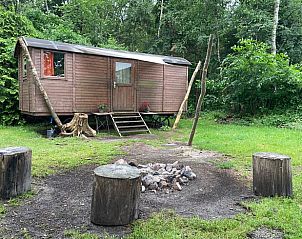 Cottage in Papenvoort, a charming cottage in the nature of Middle Drenthe, offers a rustic experience with campfire pit and wooded area.