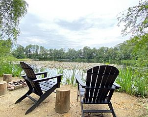 Enjoy the serene view of the pond at Holiday Home in Papenvoort, an idyllic vacation home in Midden Drenthe, Drenthe.