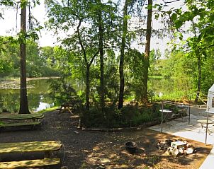 Enjoy the serenity of nature at Cottage in Papenvoort, a vacation home in Central Drenthe, overlooking a beautiful forest lake.