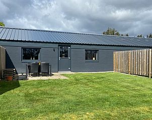 Buitenterras van Vakantiehuis in Odoorn, Midden Drenthe, met zitgelegenheid.