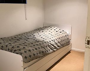 Rustieke slaapkamer in Vakantiehuisje in Norg, Noord Drenthe, ideaal voor een goede nachtrust.