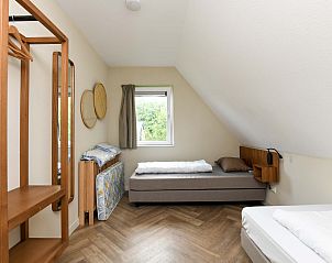 Zolderkamer met bedden in Vrijstaande woning in AALDEN in Drenthe.