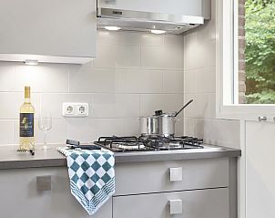 Bedroom with beds made up in Aelderholt 2-person bungalow 2C in Aalden, Drenthe.