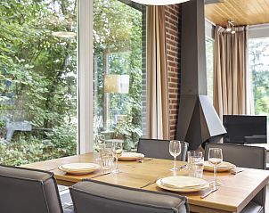 Night table with lamp in Aelderholt 2-bed bungalow 2C in Aalden, Drenthe.