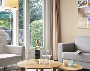 Back of Aelderholt 2-bed bungalow 2C in Aalden, Drenthe with green surroundings.