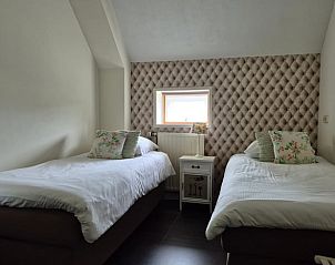 Gezellige slaapkamer in Vakantiehuis in Dalerveen, Zuidoost Drenthe, met comfortabele bedden en sfeervol interieur voor een ontspannen verblijf.