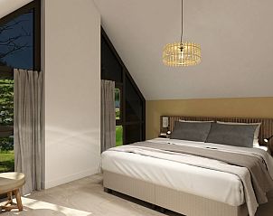 Sfeervolle slaapkamer in de Vrijstaande woning in Emmen, Drenthe, biedt comfort in dit vakantiehuis in Zuidoost Drenthe.