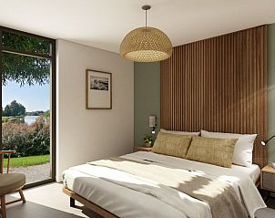 Slaapkamer met tuinzicht in de Vrijstaande woning in Emmen, serene vakantieplek in Zuidoost Drenthe.