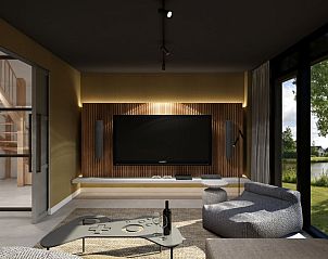 Moderne woonkamer met entertainmentopties in de vrijstaande woning in Emmen, Zuidoost Drenthe, Drenthe.