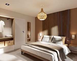 Sfeervolle slaapkamer in Vrijstaande woning in Emmen, vakantiehuis in Drenthe met rustieke inrichting.