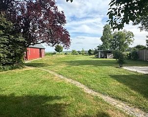 Landelijk uitzicht vanuit de tuin van Vakantiehuis in Schoonoord, Drenthe.