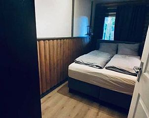 Knusse slaapkamer in Vakantiehuis in Erm, Drenthe, perfect voor een goede nachtrust.