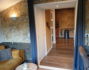 Gemtlicher Innenbereich des Ferienhauses in Stieltjeskanaal, Sdost-Drenthe, mit gemtlicher Einrichtung und komfortabler Sitzecke.