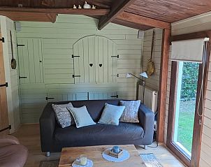 Sfeervolle woonkamer in Vakantiehuis in Erica, Drenthe, met comfortabele inrichting.