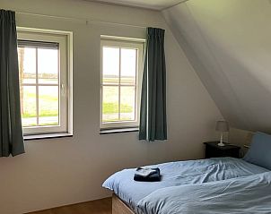 Slaapkamer in Huisje in Exlorveen, vakantiehuis in Drenthe met comfortabele bedden.