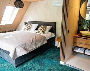 Comfortabele slaapkamer in Vakantiehuis in Fluitenberg, Zuidwest Drenthe, met eigen badkamer.