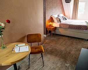 Knusse zithoek in Vakantiehuis in Fluitenberg, Drenthe, ideaal voor ontspanning in een sfeervolle omgeving.