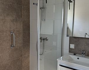 Luxury bathroom in Holiday Home in Doldersum, Drenthe with modern shower.