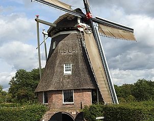 Charmante molen nabij Vrijstaande woning in Ruinen, Drenthe, omringd door groene natuur en rustieke schoonheid.