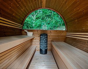 Panoramisch uitzicht vanuit de sauna bij Tiny Houselodge Eris, een glamping lodge in Dwingeloo, Drenthe.