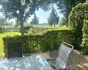 Genieen Sie den ruhigen Garten und die grne Umgebung des Ferienhauses DG2051 in Ruinerwold, im Sdwesten von Drenthe, ideal fr Naturliebhaber.