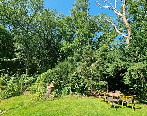 Gartenecke mit Sitzgelegenheit im Ferienhaus in Wateren, Sdwest-Drenthe.