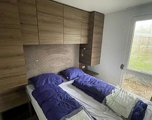 Comfortabele slaapkamer in Vakantiehuis Cosy Unique 4 in Biddinghuizen, perfect voor een goede nachtrust in Flevoland.