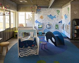 Children's corner in Safari Tent Wood, Biddinghuizen, with colorful play equipment and books in Flevoland.