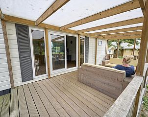 Veranda with seating at Mobile home | 6 Persons, Biddinghuizen, Eastern Flevoland. Relax in nature.