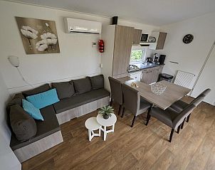 Living room with modern furnishings in Mobile home | 6 Persons, Biddinghuizen, Eastern Flevoland. Comfortable and stylish.