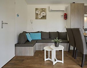 Cozy sitting area with sofa and cushions in Mobile Home | 6 Persons, Biddinghuizen, Eastern Flevoland.