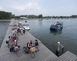 Ferry service at the dock of Mobile Home | 6 Persons, Biddinghuizen, Eastern Flevoland. Easy transportation by water.