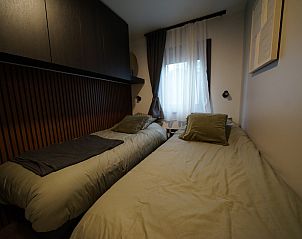 Tweede slaapkamer in Chalet in Biddinghuizen, vakantiehuis in Flevoland met twee comfortabele bedden.