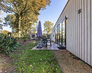 Enjoy the serene garden and terrace of the Detached House in Biddinghuizen, a vacation home in the green heart of Flevoland.