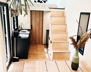 Modern kitchen and stairs to loft in Holiday home in Rutten, Eastern Flevoland, perfect for a relaxing stay.