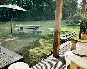 Spacious lawn and picnic table at Holiday Home in Rutten, Eastern Flevoland, ideal for outdoor activities.