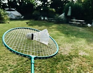 Play badminton on the grass at Holiday Home in Rutten, Eastern Flevoland, for sporting relaxation.