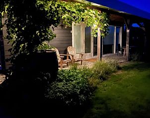 Atmospheric evening lighting on the terrace of Holiday Home in Kraggenburg, Flevoland.