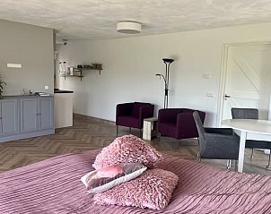 Cozy living space in Holiday home in Kraggenburg with comfortable seating in Flevoland.